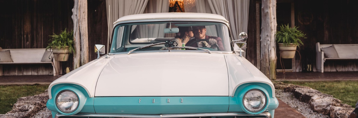 bride and groom in an vintage Ford
